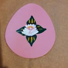 Egg shaped wooden magnet with canal art style rose
