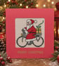 Handmade Cross Stitch Santa on Bicycle Christmas Card – 5 x 5 Inch - Image 1