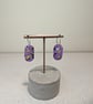 Abstract pill purple hoop dangles