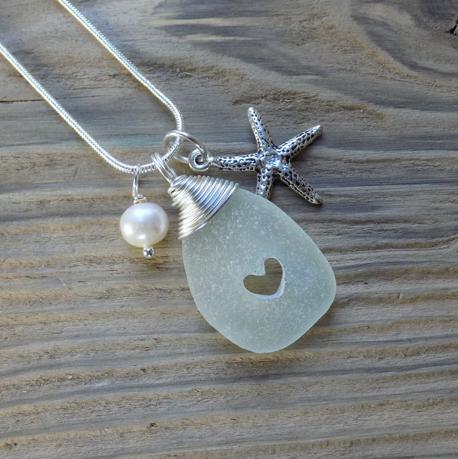 Natural sea glass drilled heart ,wire wrapped pendant