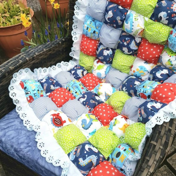 Cot quilts in vibrant dinosaur or pig puff ball patchwork fabric