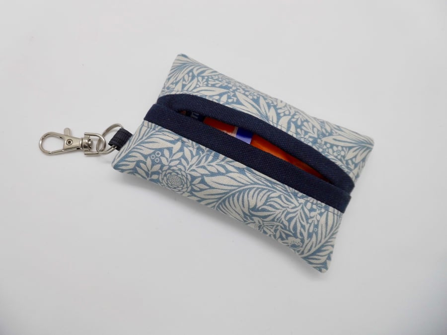 Key ring tissue holder for tissues or face mask in William Morris fabric.