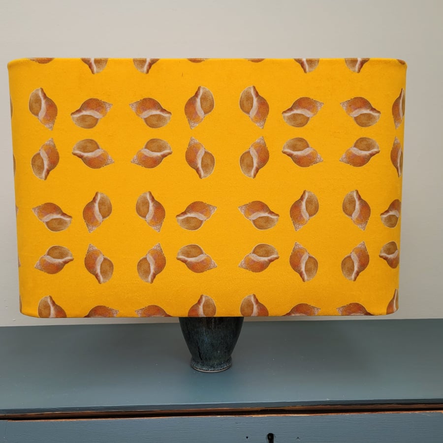 Rectangular table lamp lampshade with rounded corners and a unique shell design