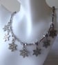 Necklace with Seven Enamelled Snowflakes & Faceted Glass and Metal beads - Image 1