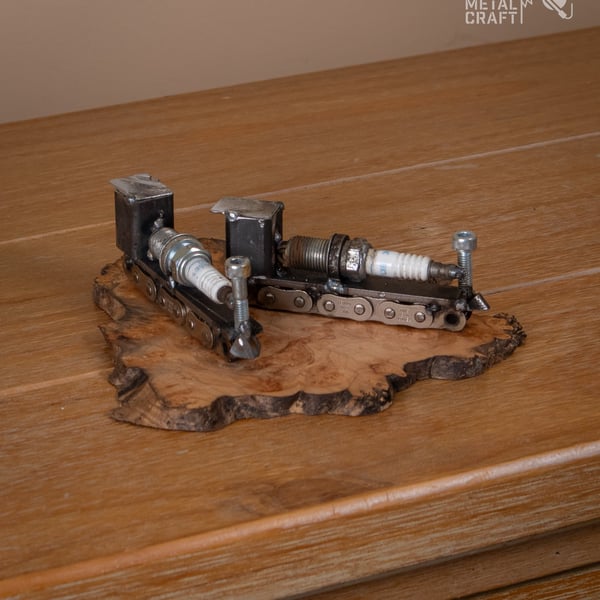 Spark plug train