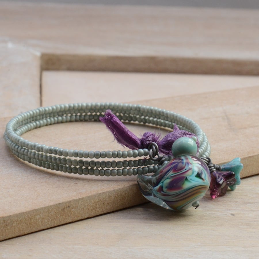Memory Wire Wrap Seed Bead Bracelet with Lampwork Glass Bird