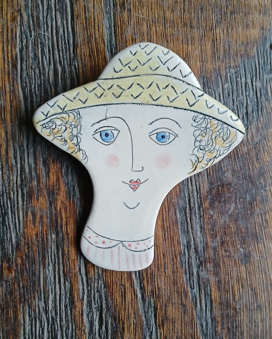 Lady face brooches 