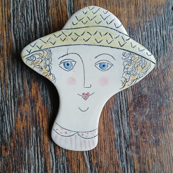 Lady face brooches 