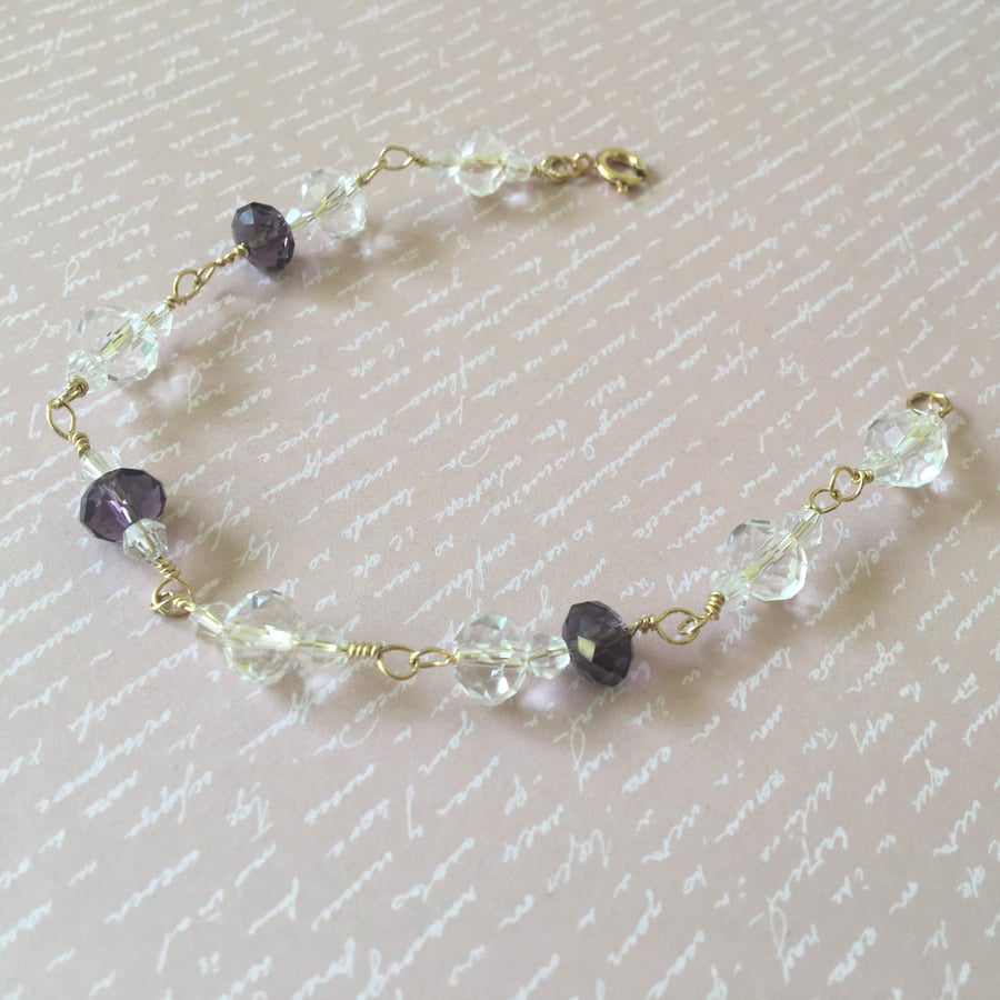 Simple elegant white and purple glass beads bracelet.