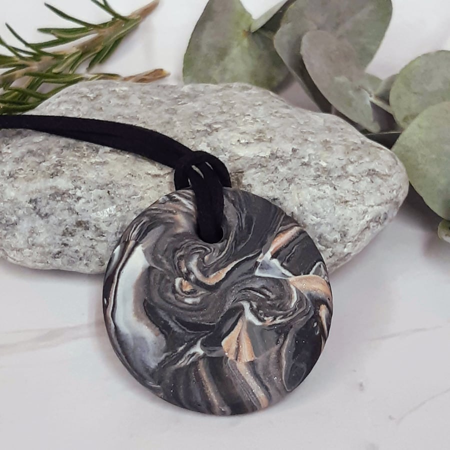 Black, silver and sienna round pendant