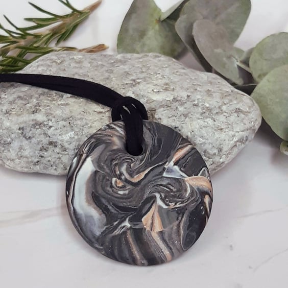 Black, silver and sienna round pendant