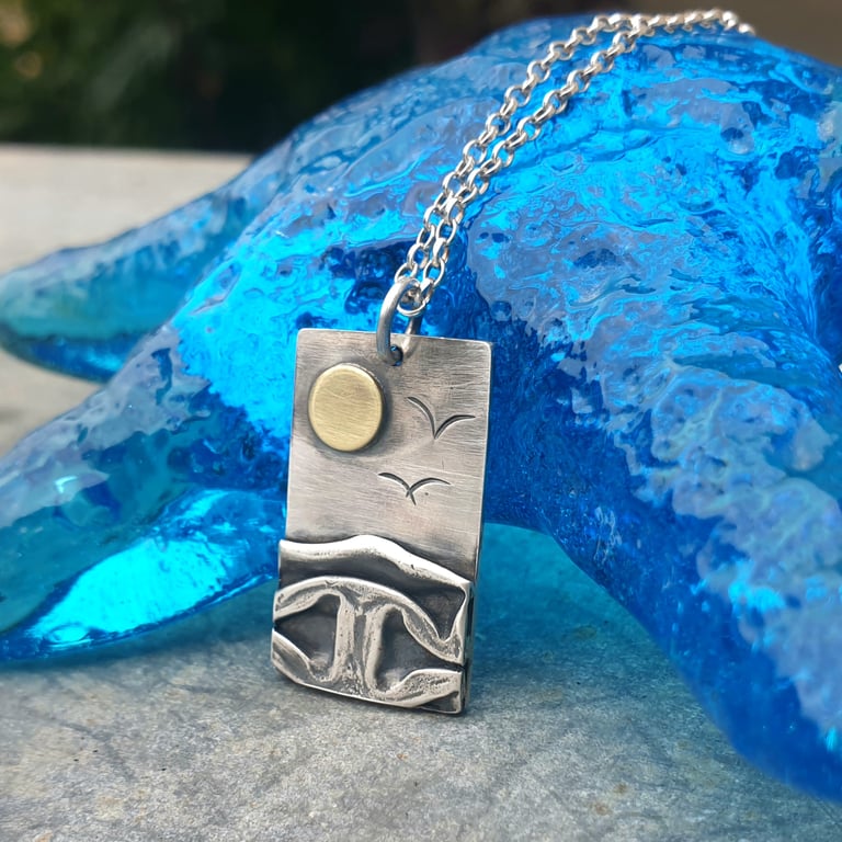 Silver beach, sea coast pendant, with brass sun and seagulls