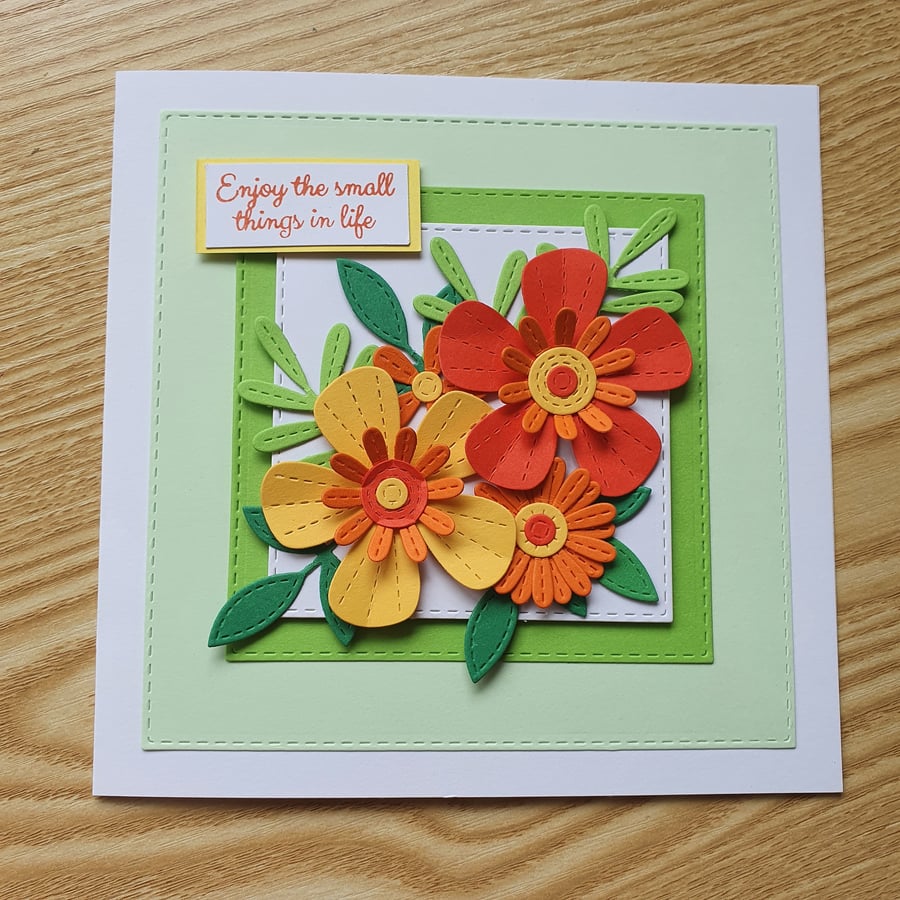 A floral die cut birthday card