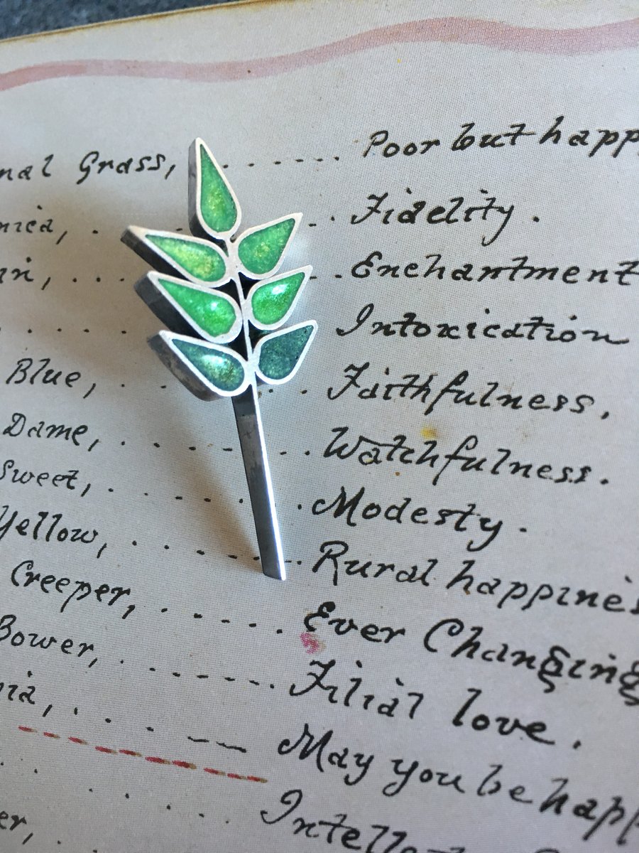 Grass seed brooch in the Language of Flowers.