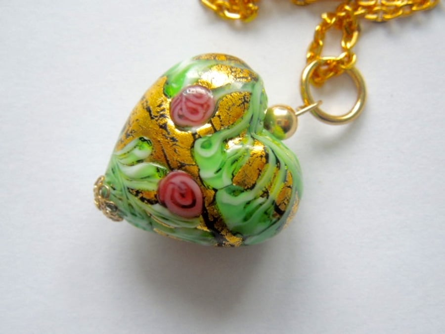 Gold Murano glass decorated heart pendant.