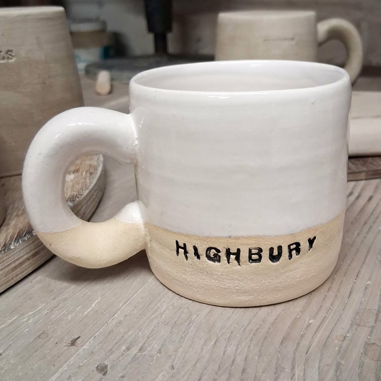Highbury logo Wheel thrown durable stoneware mug.