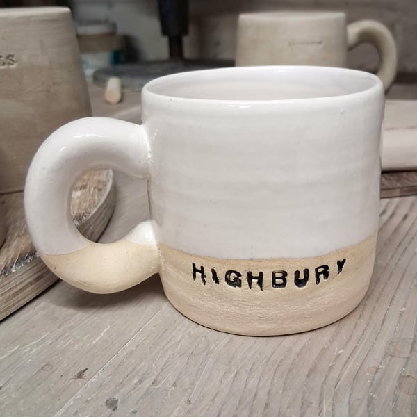 Highbury logo Wheel thrown durable stoneware mug.
