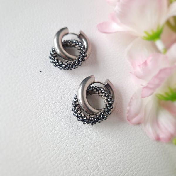 Silver hoop stainless steel earrings with beaded circle charm