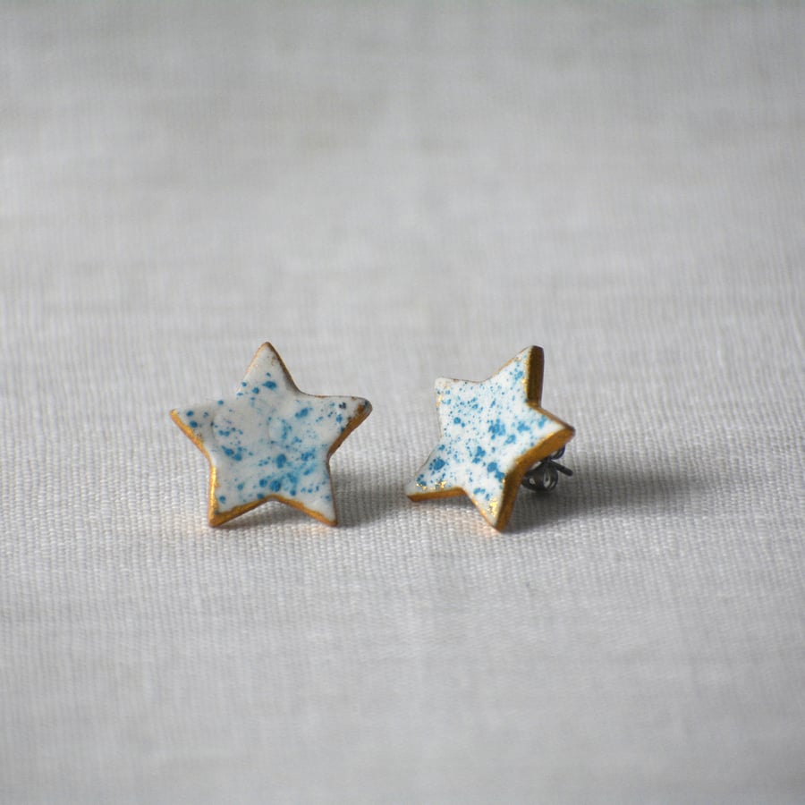 Porcelain star earrings with turquoise speckled detail 