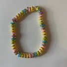 A cute bracelet with a pastel rainbow and gold beads!!!