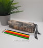 Pencil case box shaped in gold and grey.  - Image 1