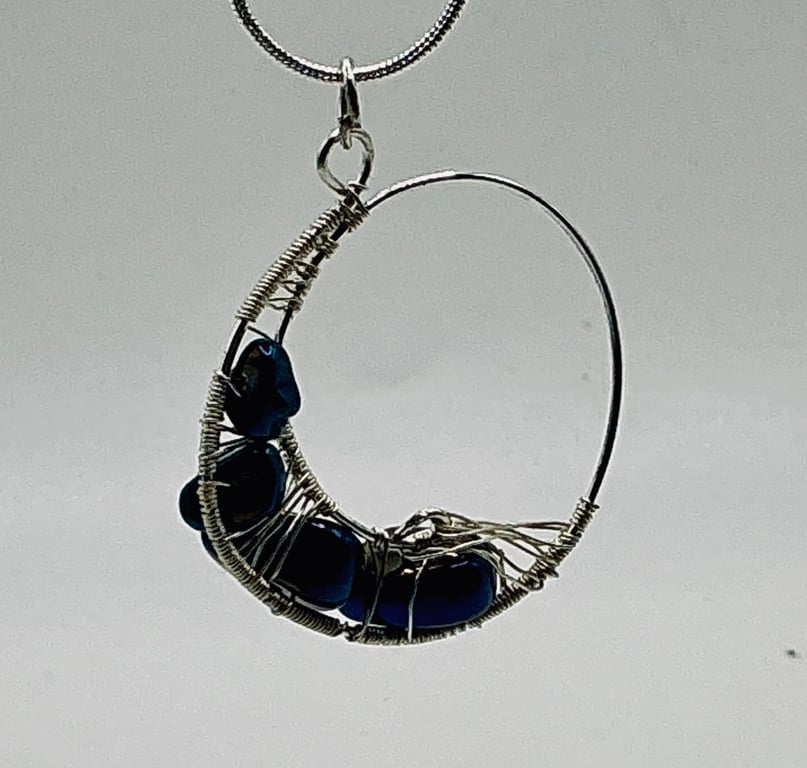 Circular Sparkling Midnight Blue Hematite and Silver Plated Pendant