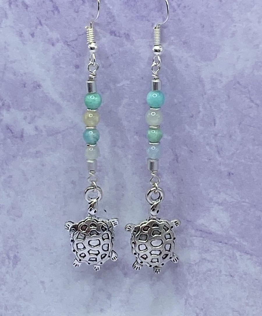 Dangle earrings with silver tone turtle charms, amazonite and aquamarine
