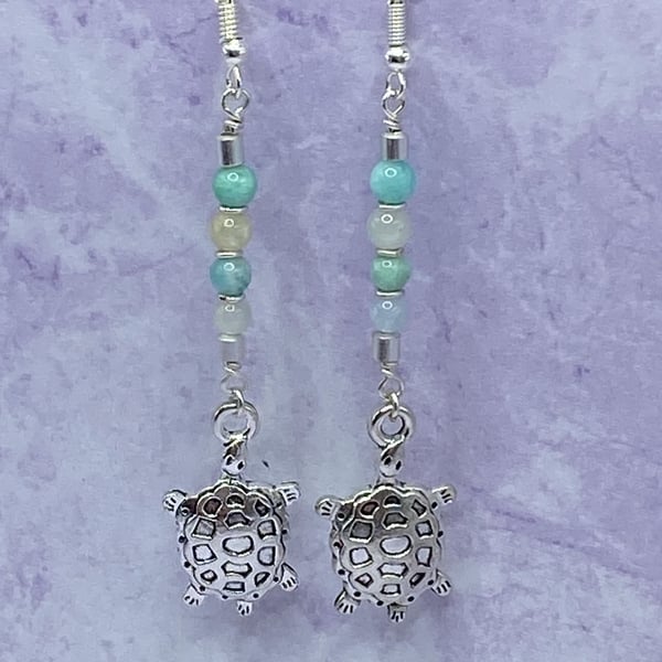 Dangle earrings with silver tone turtle charms, amazonite and aquamarine