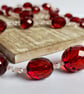 Garnet Glow Faceted Acrylic Beaded Necklace - Image 1