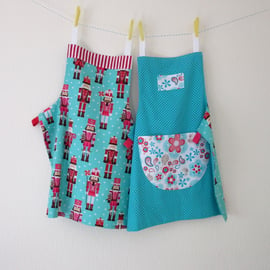 Child's Apron - Nutcracker Pink, Red and Aqua Flowers - Reversible 