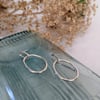Wobbly oval silver earrings