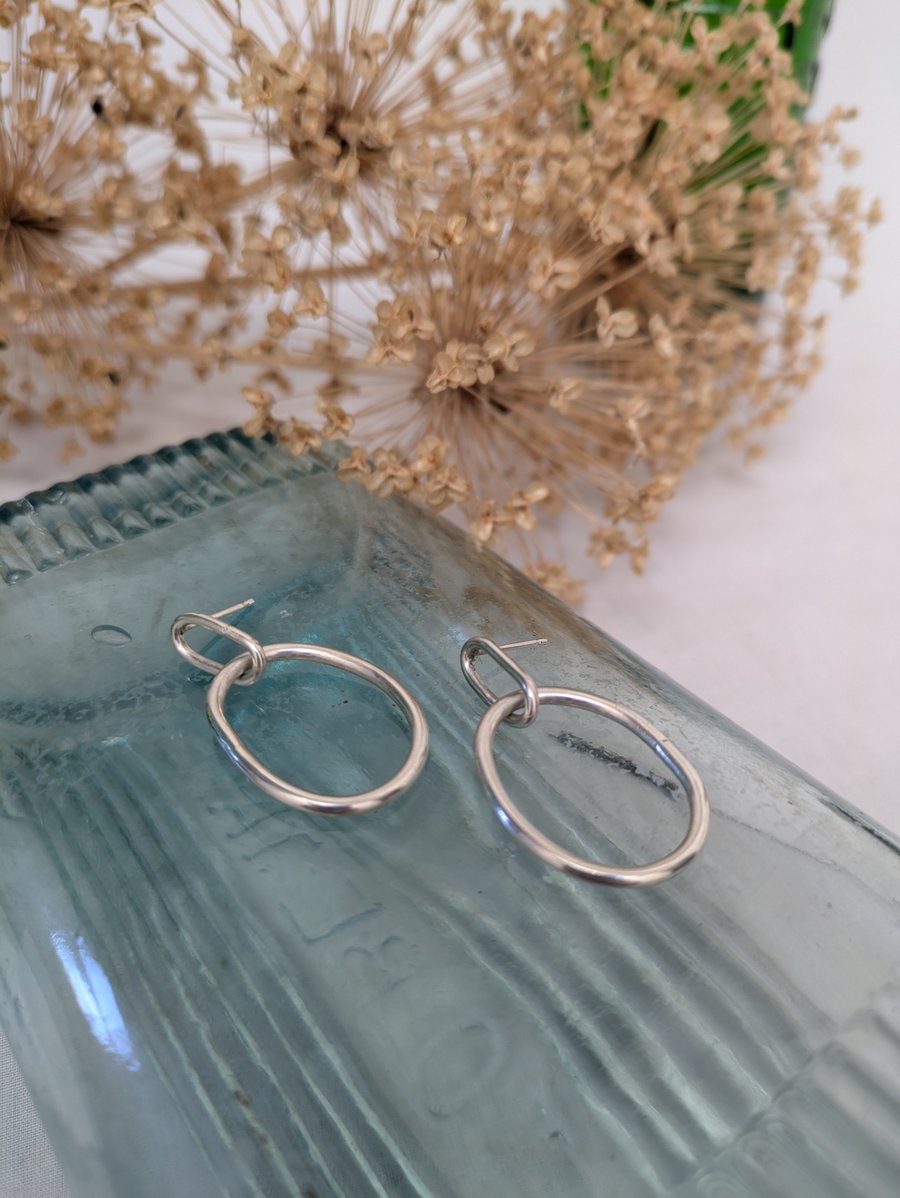Wobbly oval silver earrings