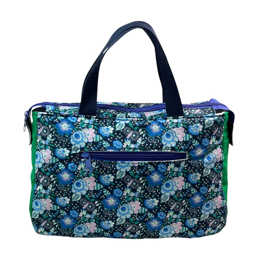 large toiletries bag made from  Liberty fabric, with handles and pockets 