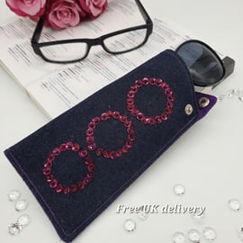 Glasses case, denim, pink circles and purple lining. 