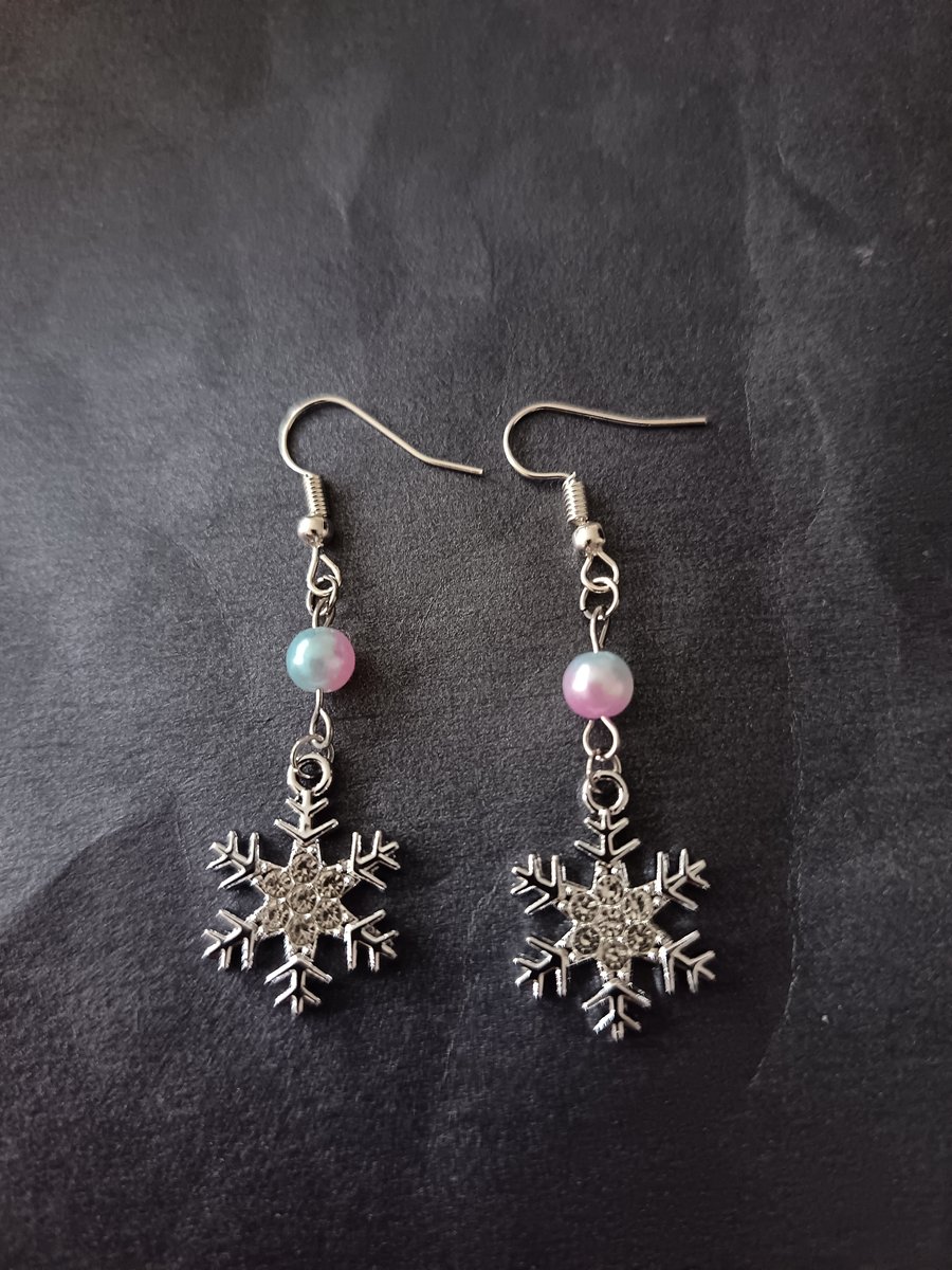 Silver snowflake charm dangle earrings with pastel bead 