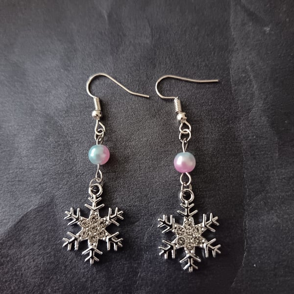 Silver snowflake charm dangle earrings with pastel bead 