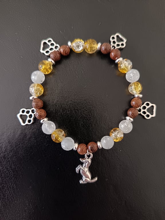 Elasticated beaded bracelet with silver dog and paw print charms 
