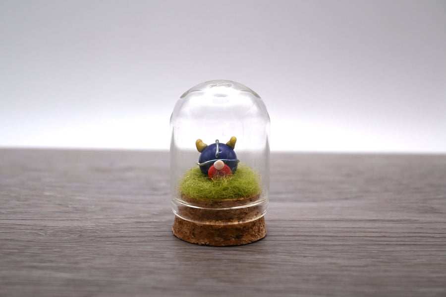 small glass viking figure in cloche jar
