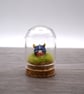 small glass viking figure in cloche jar