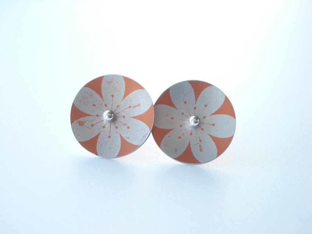 Flower studs in orange and silver