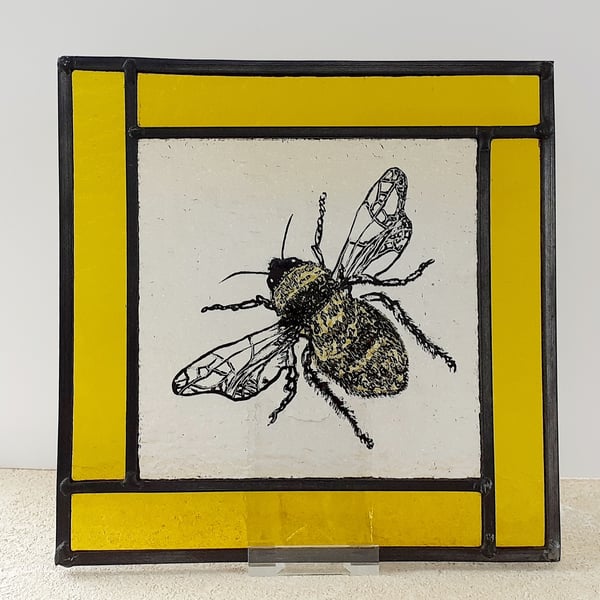 Leaded stained glass panel with painted bee design