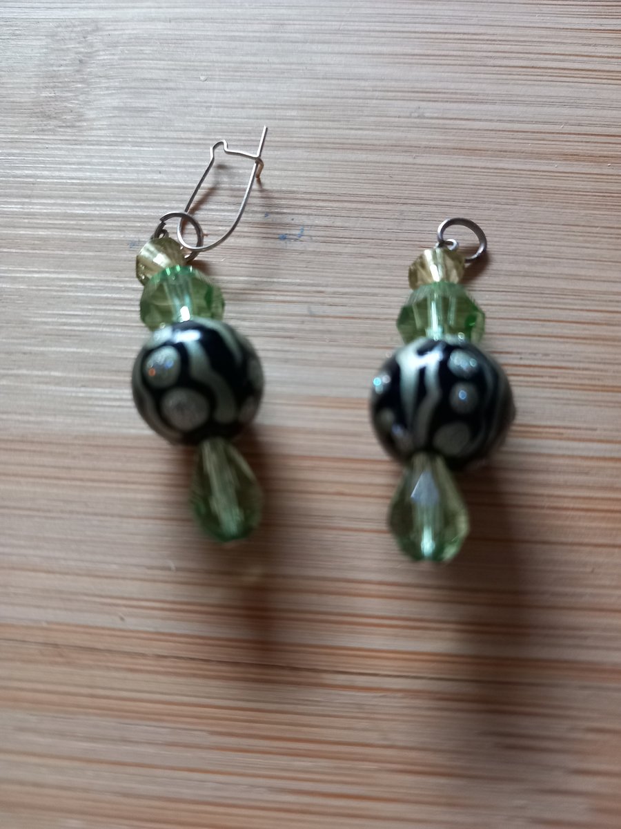 Green and black beaded earrings for pierced ears