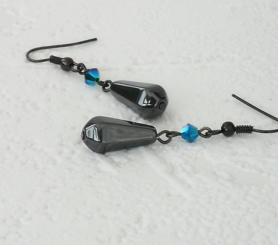 Hematite and crystal earrings, made with emerald crystal by Swarovski®