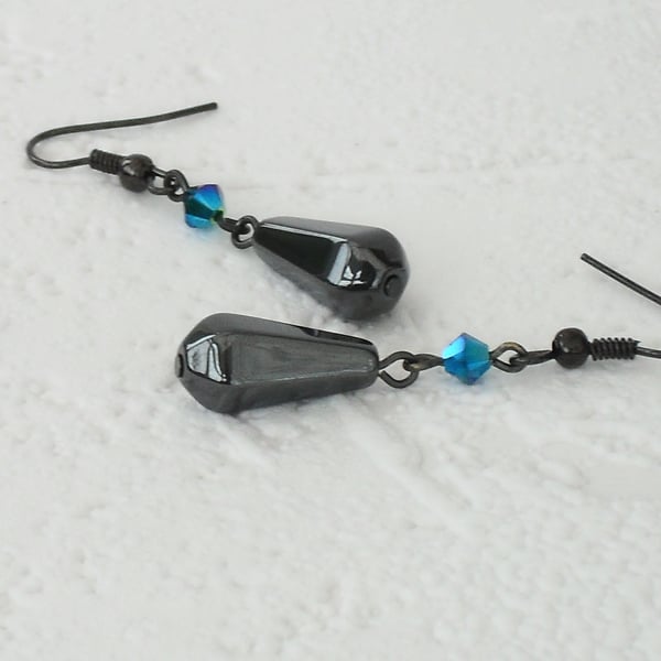 Hematite and crystal earrings, made with emerald crystal by Swarovski®