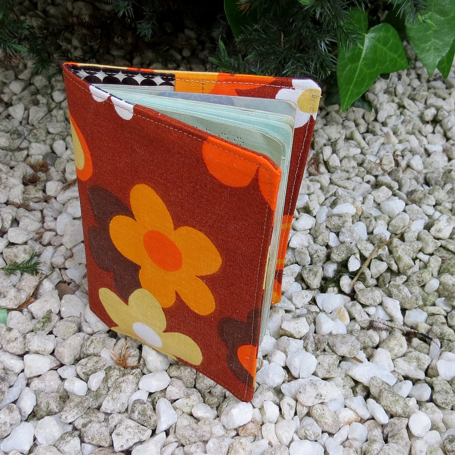 A groovy flower power passport sleeve.  Made from a vintage 1960s fabric.
