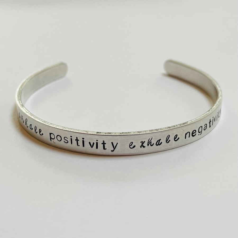 ‘Inhale positivity exhale negativity’ stamped cuff bracelet