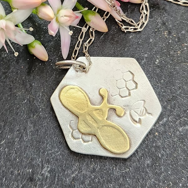 Brass bee on sterling silver hexagon pendant