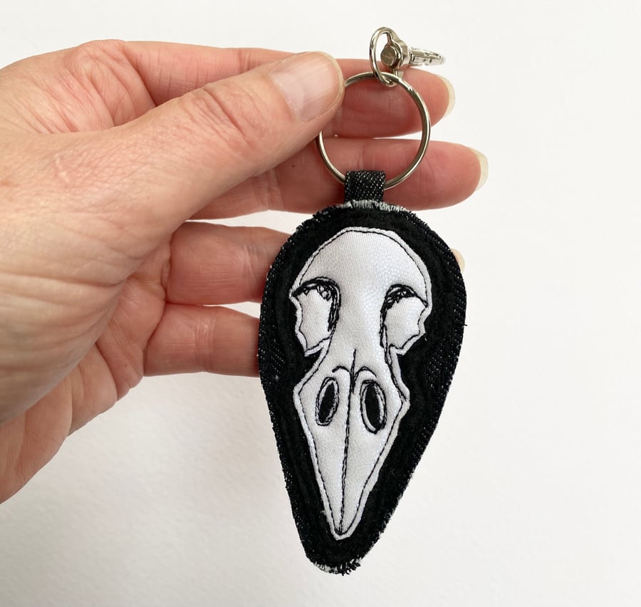 Up-cycled bird skull key ring or bag charm. 