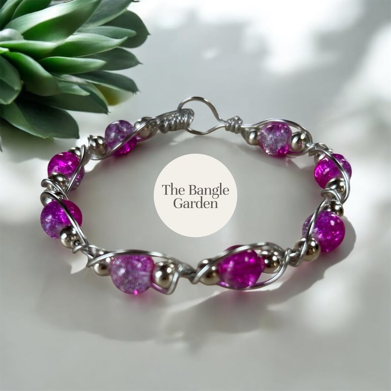 Handmade wire wrapped bangle with vibrant pink variegated and silver beads 