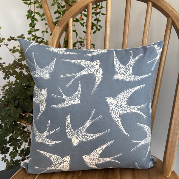 Cushion cover with a bird print in navy and white with striped back, 40cm x 40cm
